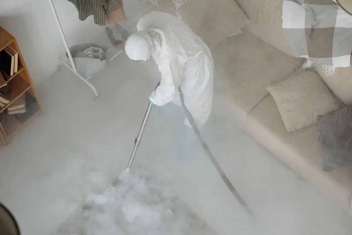 Biohazard cleanup technician in protective equipment, Littleton Common, MA